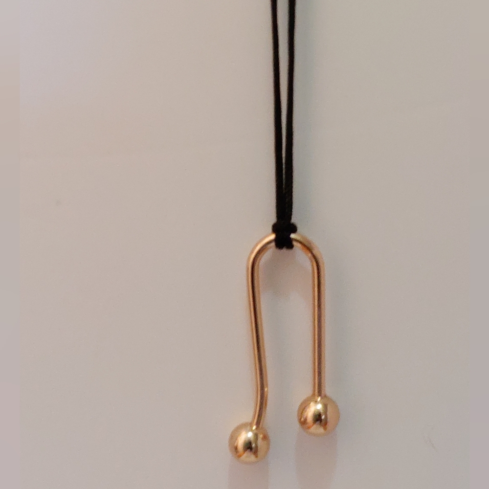 Geometric Shaped Gold Metal Pendant On Black Cord Necklace